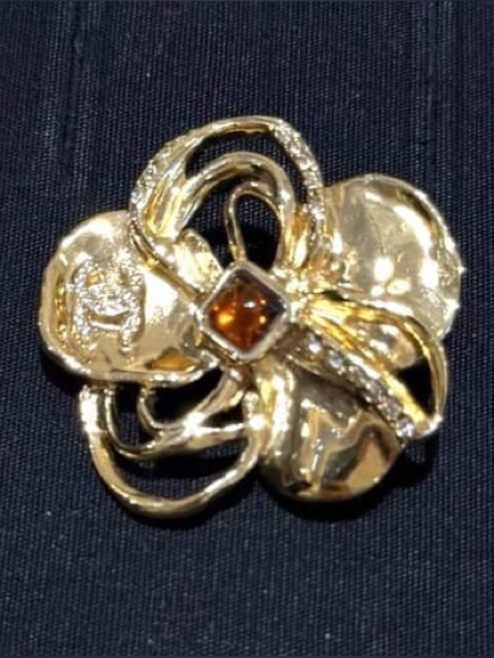 Chanel gold camellia brooch